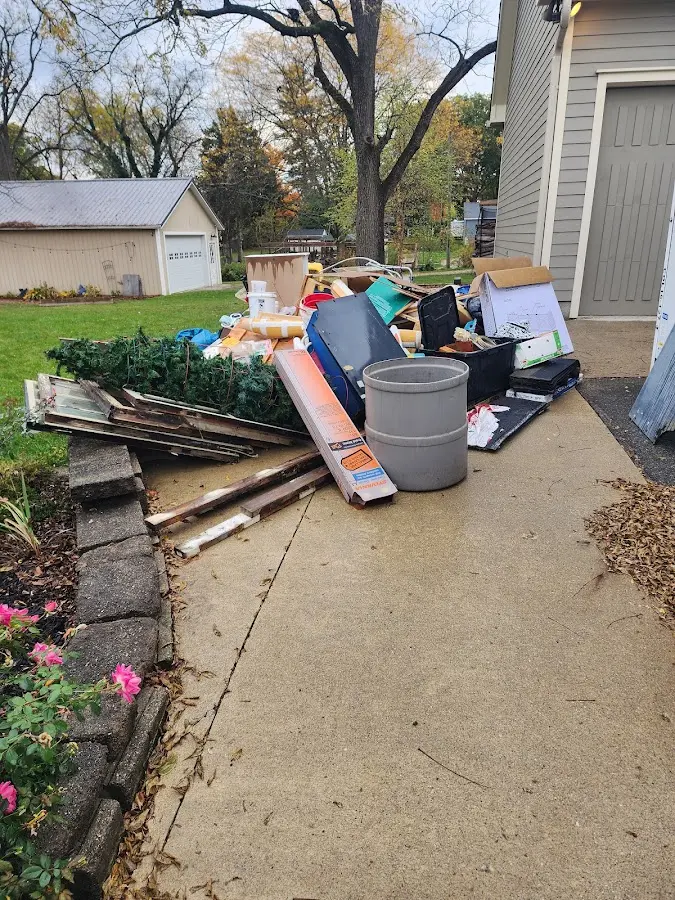 Dumpster being loaded with debris for Roofing Dumpster Rental in Reserve